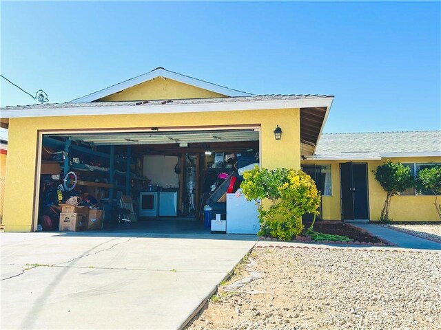 10907 Bartlett, Adelanto, CA 92301 - view of front of home featuring concrete driveway and stucco siding