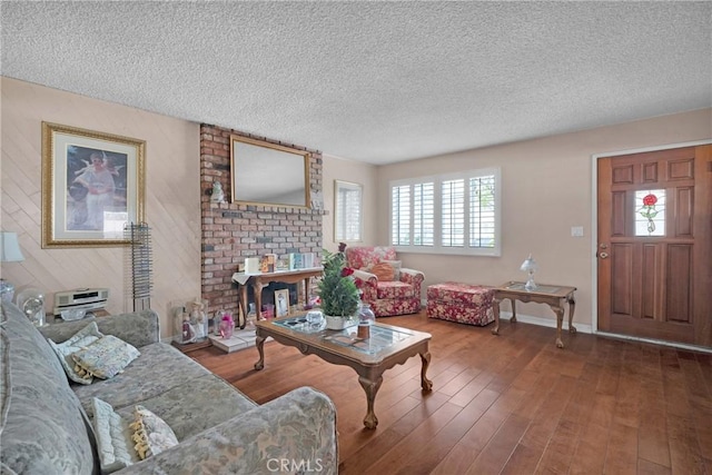 living room with hardwood / wood-style flooring and a textured ceiling