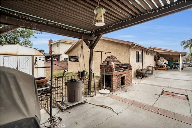 view of patio with a storage unit