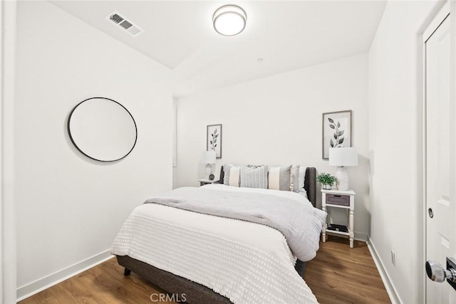 bedroom with hardwood / wood-style floors