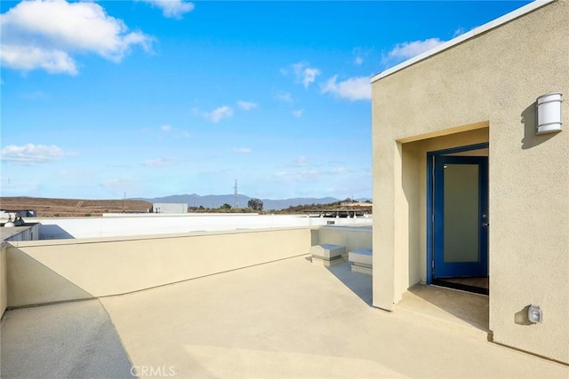 view of patio / terrace with a mountain view