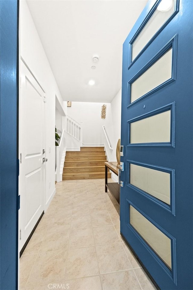 foyer entrance with light wood-type flooring