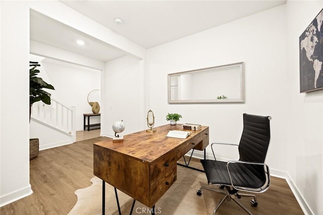 home office featuring hardwood / wood-style floors