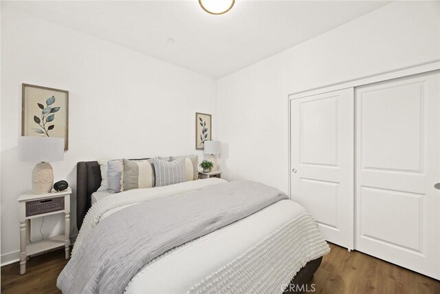 bedroom featuring a closet and wood finished floors