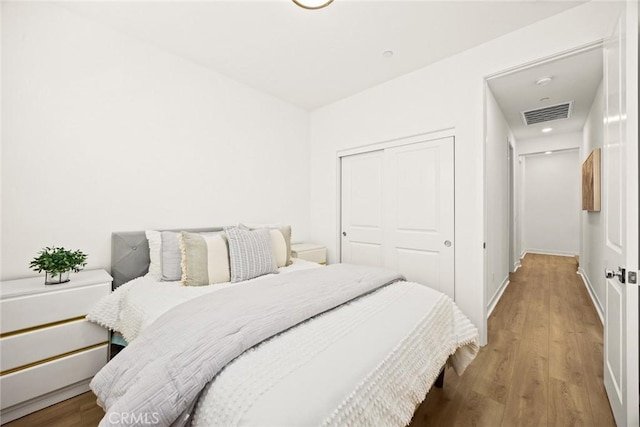 bedroom featuring a closet and hardwood / wood-style floors