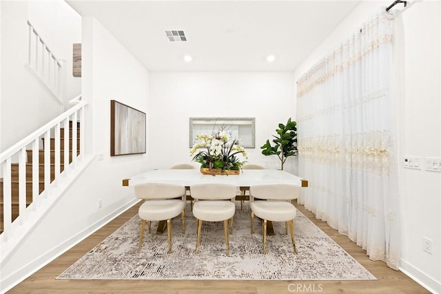 dining area featuring wood-type flooring