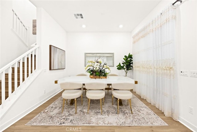 dining area with recessed lighting, wood finished floors, visible vents, and baseboards