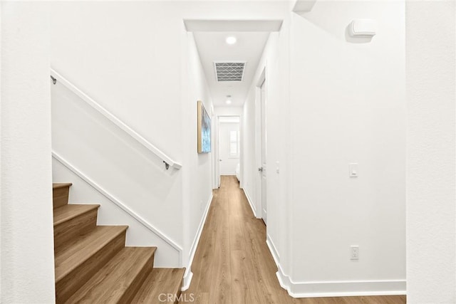 corridor featuring light hardwood / wood-style floors