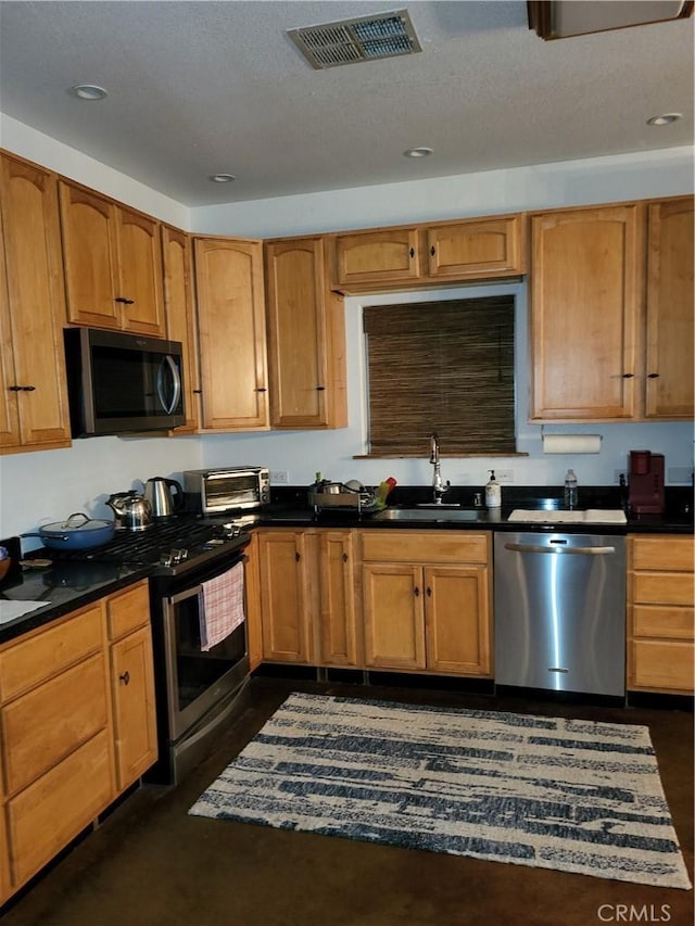 kitchen featuring stainless steel appliances and sink