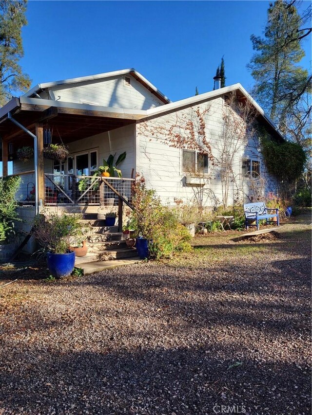 view of home's exterior featuring covered porch