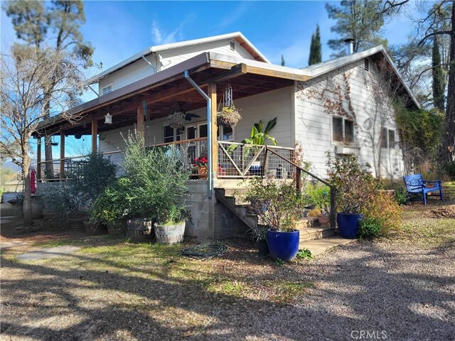 exterior space featuring ceiling fan and covered porch