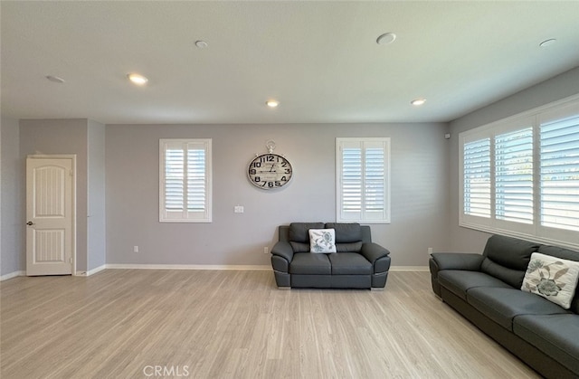 living room with a healthy amount of sunlight and light wood-type flooring