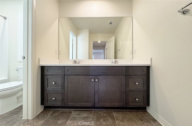 bathroom with toilet and vanity