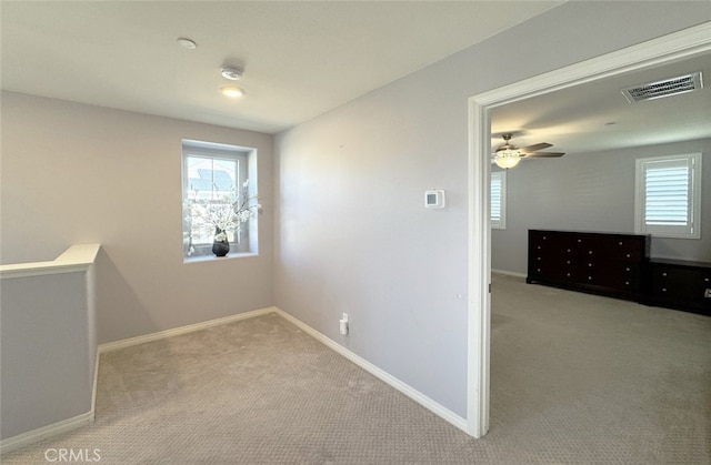 interior space featuring ceiling fan and plenty of natural light