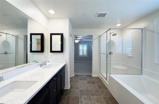 bathroom with ceiling fan, vanity, and separate shower and tub