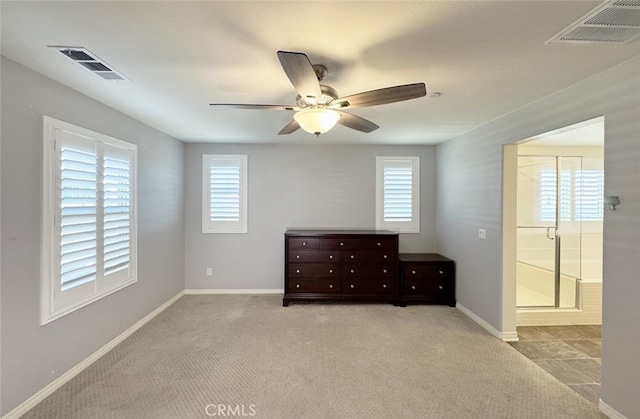 unfurnished bedroom featuring ceiling fan and light carpet