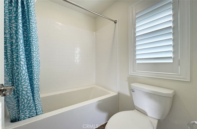 bathroom with toilet and shower / bathtub combination with curtain