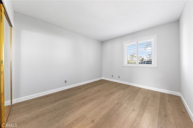 spare room featuring light hardwood / wood-style floors