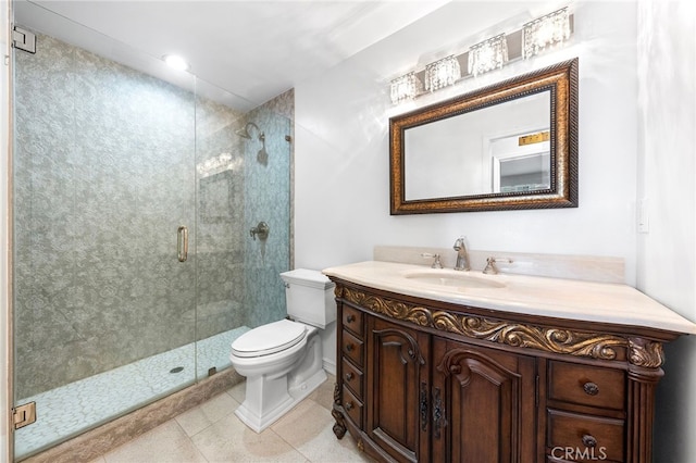 bathroom with toilet, a shower with shower door, and vanity