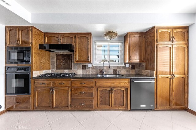 kitchen featuring light tile patterned flooring, black appliances, tasteful backsplash, and sink