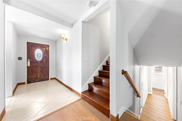 foyer entrance with a healthy amount of sunlight and light wood-type flooring