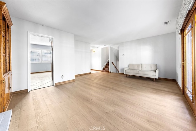 unfurnished living room featuring light wood-type flooring