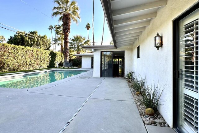 view of pool with a patio area