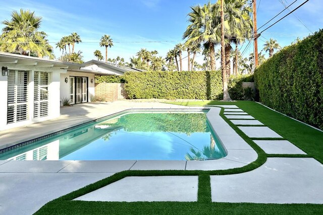 view of pool featuring a patio