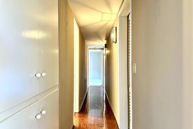 hall with dark hardwood / wood-style floors