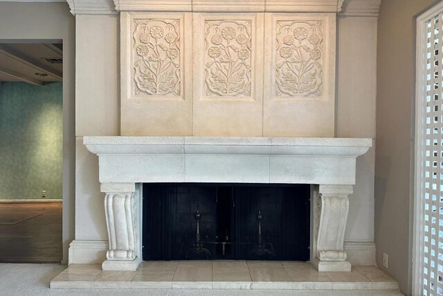 interior details with a tiled fireplace