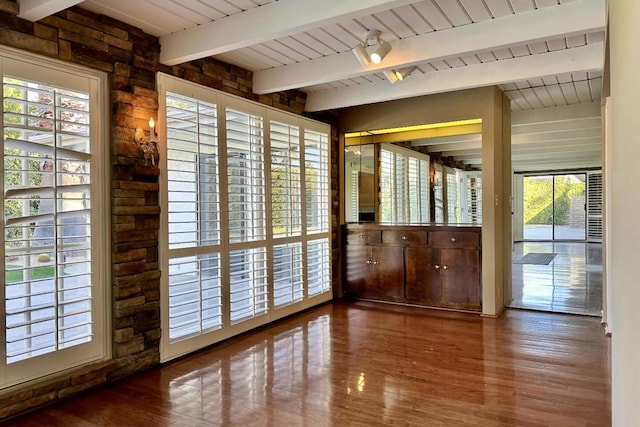 entryway featuring beam ceiling and hardwood / wood-style floors