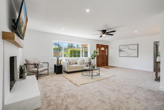 living room featuring ceiling fan and light carpet