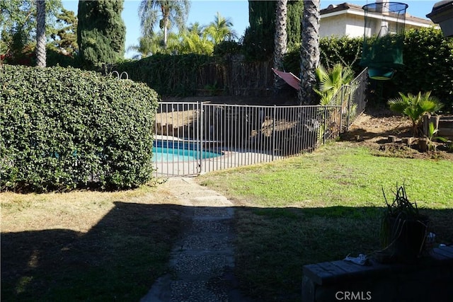 view of yard featuring a fenced in pool and a fenced backyard