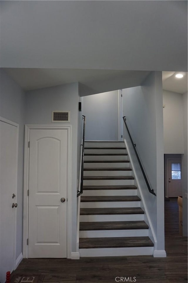 staircase featuring recessed lighting, visible vents, baseboards, and wood finished floors