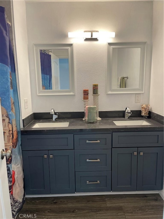 bathroom featuring vanity and wood-type flooring