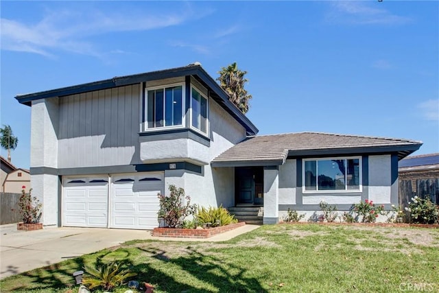 view of front facade with stucco siding, an attached garage, concrete driveway, and a front lawn