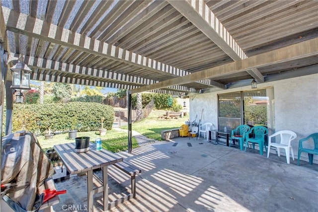 view of patio featuring fence and a pergola