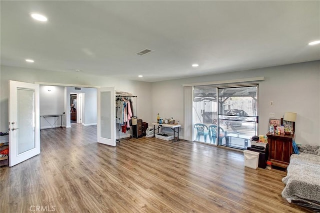 sitting room featuring recessed lighting, wood finished floors, and visible vents