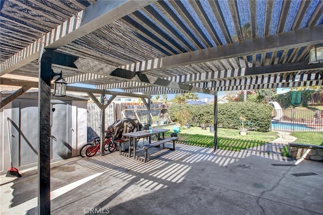 view of patio / terrace featuring a fenced in pool, fence, and a pergola