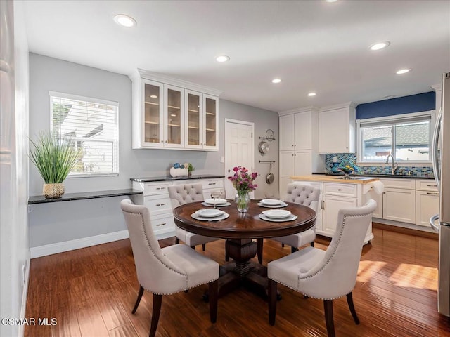 dining area featuring dark hardwood / wood-style flooring and sink