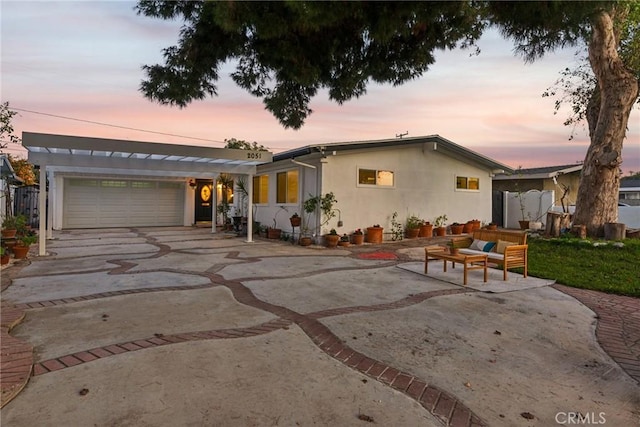 single story home with a pergola and a patio area