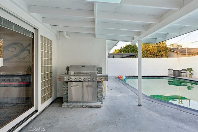 view of patio / terrace featuring a fenced in pool and grilling area