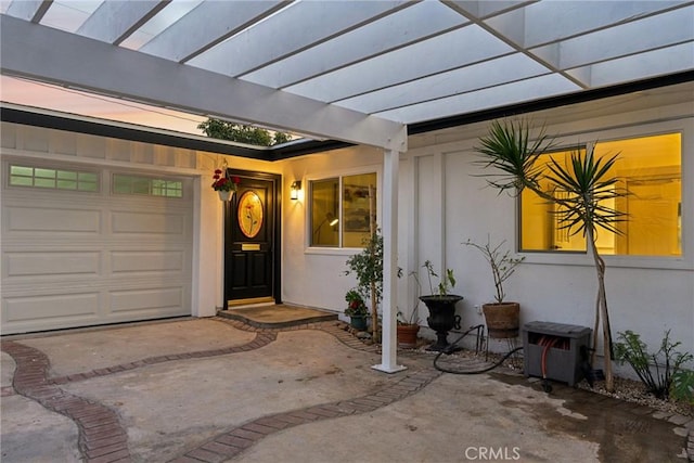 doorway to property featuring a garage