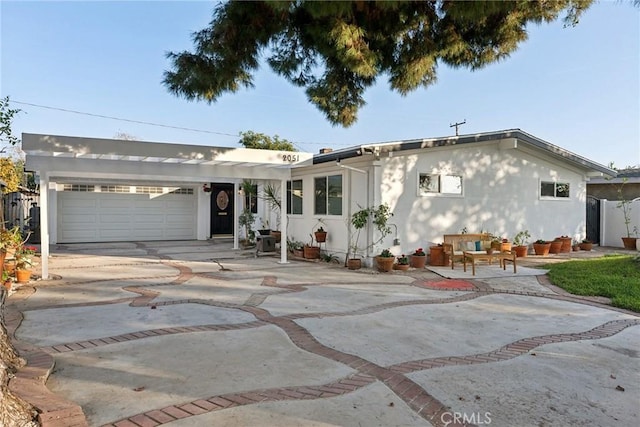 ranch-style home featuring a garage