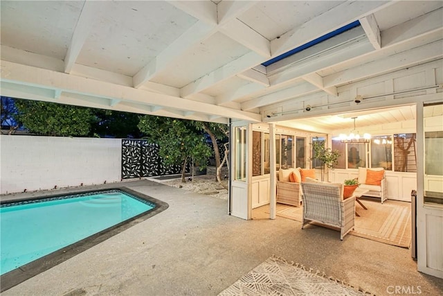 view of pool with an outdoor living space and a patio area