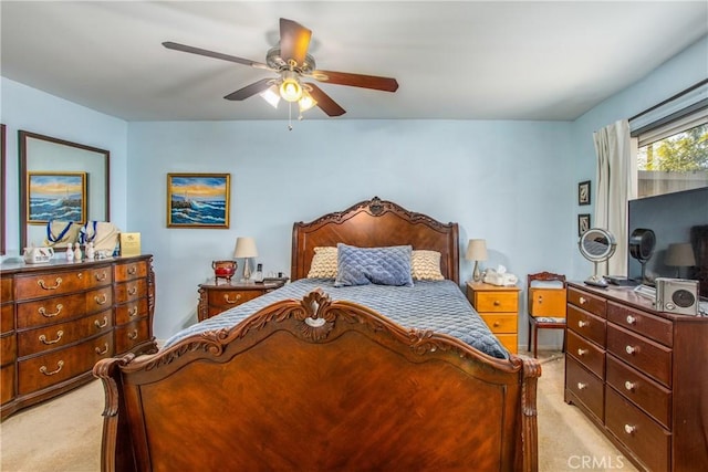 bedroom with ceiling fan and light colored carpet