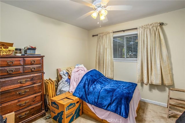 bedroom with ceiling fan and light colored carpet