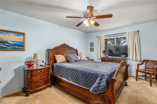 bedroom featuring ceiling fan and light carpet