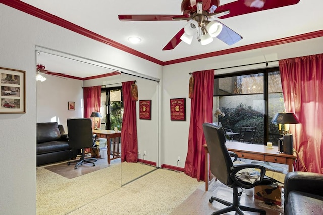 carpeted home office with ceiling fan and crown molding