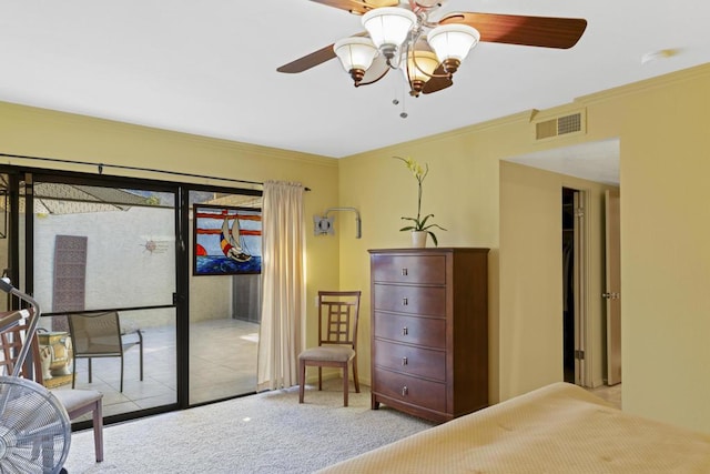 carpeted bedroom with ceiling fan, ornamental molding, and access to outside